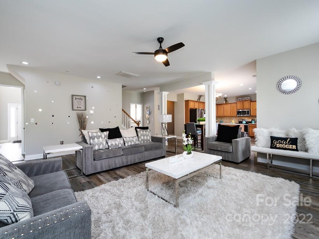 2721 Gosling Terrace Road Charlotte, NC 28262 - Photo 22 of 29 a living room with furniture kitchen view and a table