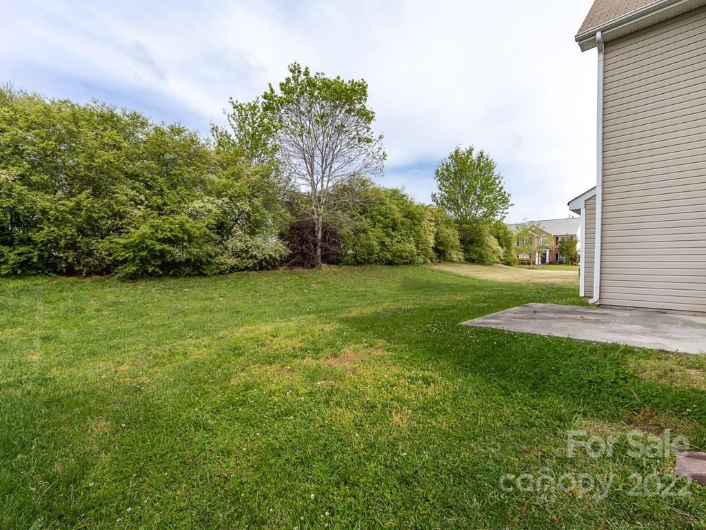 2721 Gosling Terrace Road Charlotte, NC 28262 - Photo 27 of 29 a view of a grassy field with trees