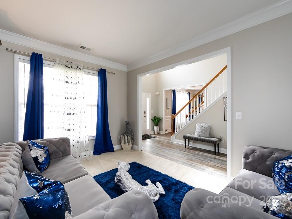 2721 Gosling Terrace Road Charlotte, NC 28262 - Photo 3 of 29 a living room with furniture and a large window
