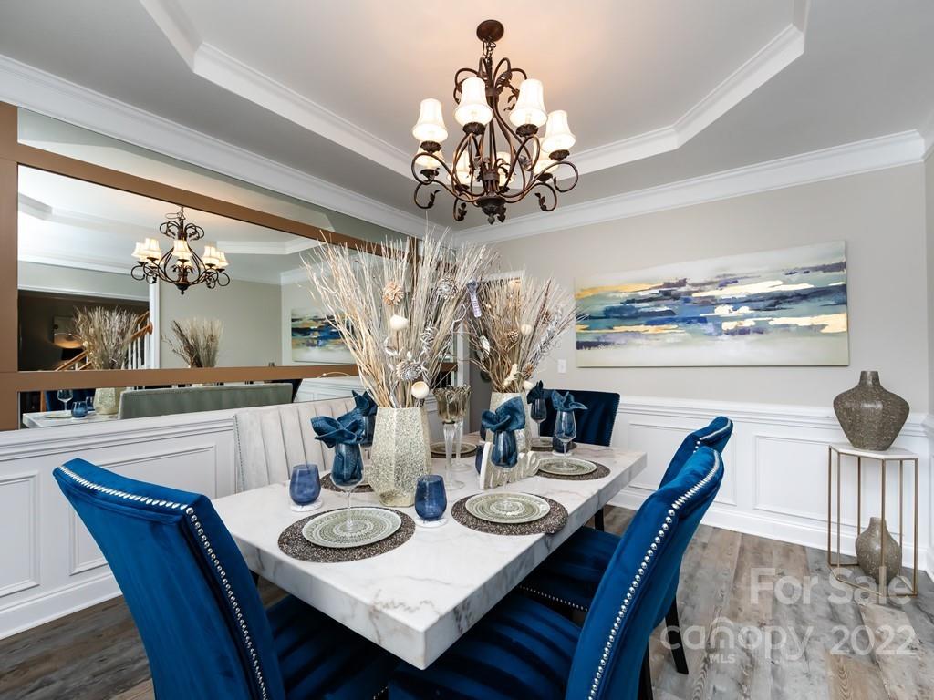 2721 Gosling Terrace Road Charlotte, NC 28262 - Photo 5 of 29 a view of a dining room with furniture wooden floor and chandelier