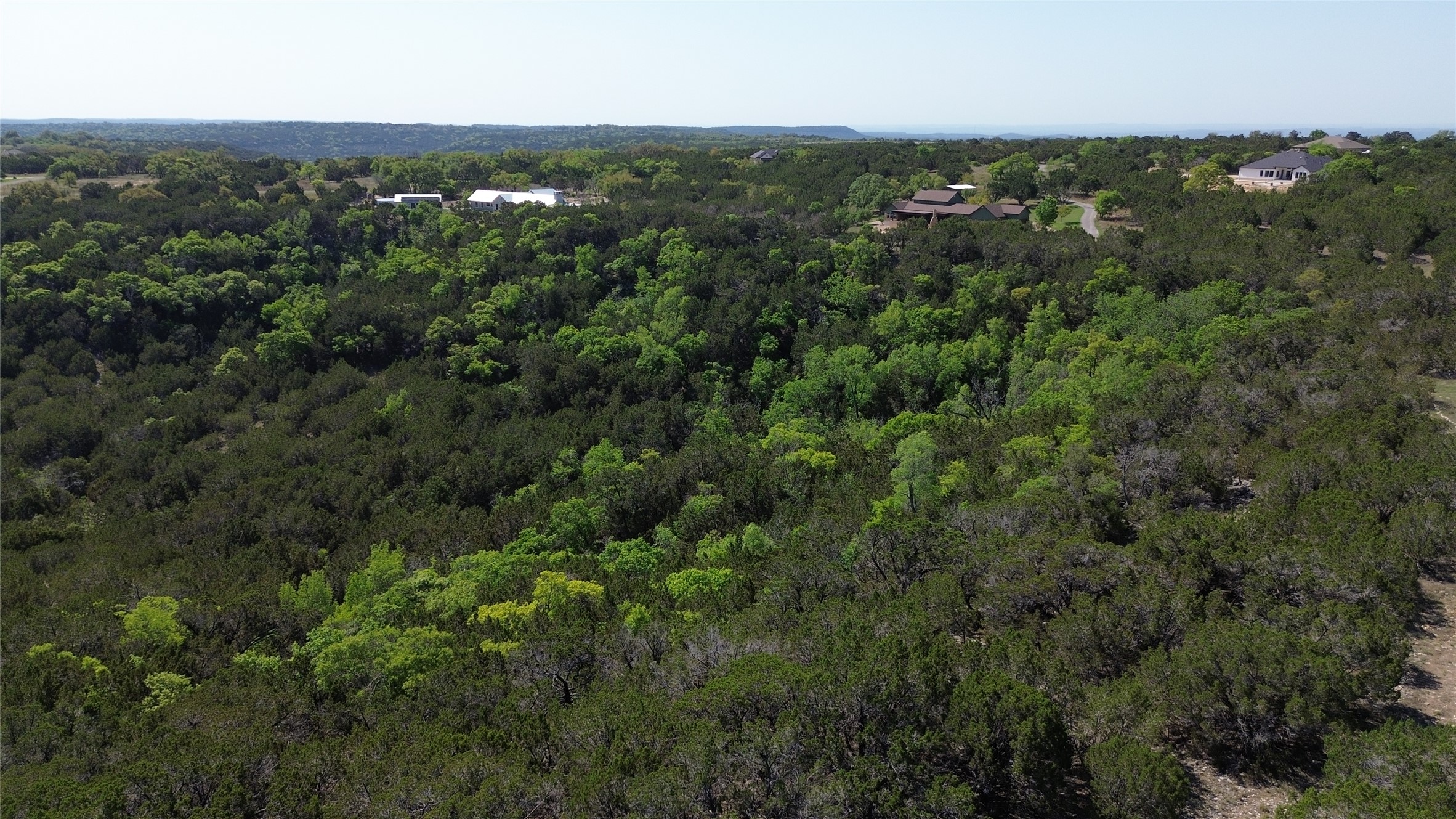 Lot 53 Balcones Ridge Way Bertram, TX 78605 - Photo 3 of 18 an aerial view of residential houses with outdoor space and trees