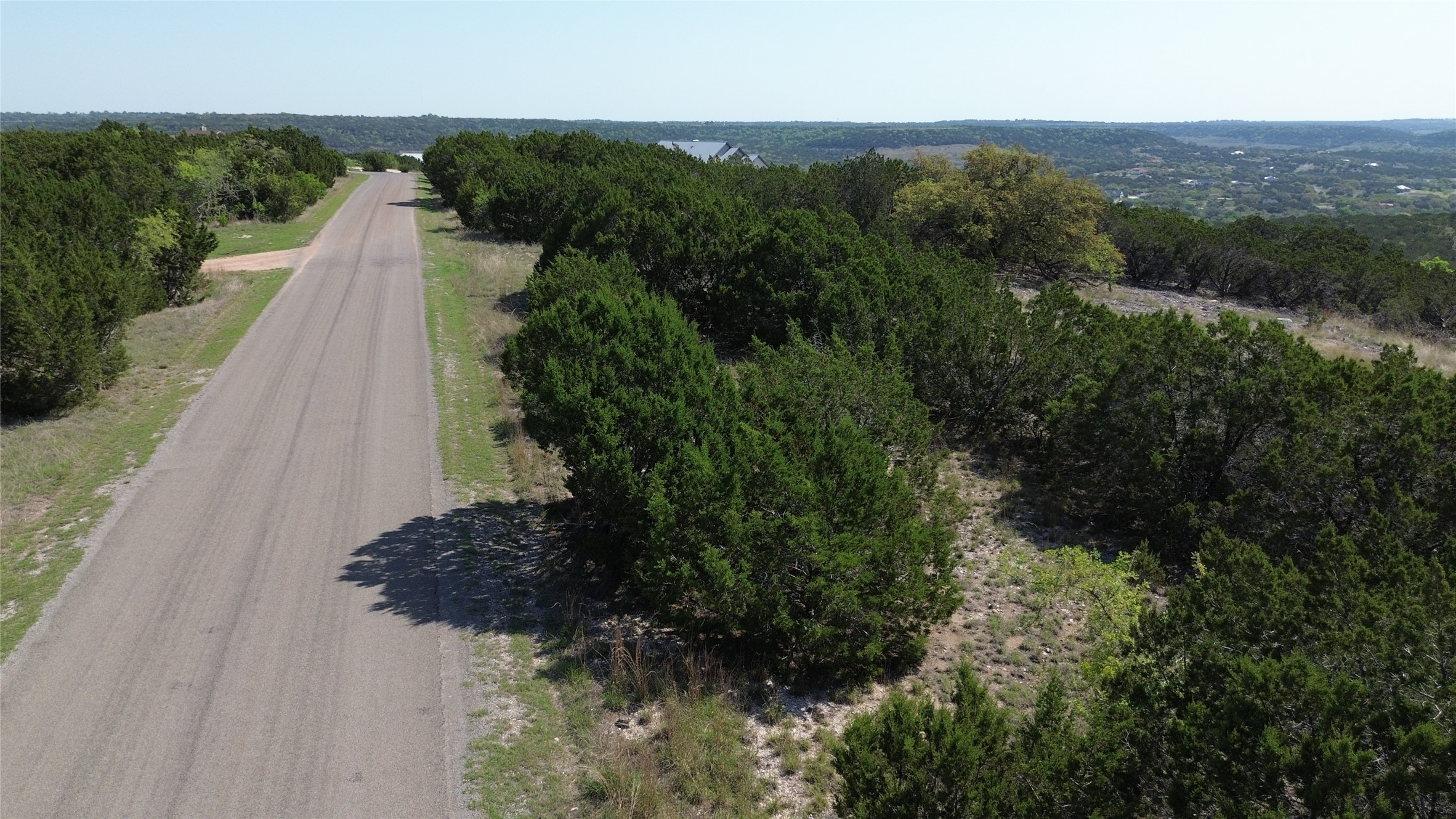 Lot 53 Balcones Ridge Way Bertram, TX 78605 - Photo 4 of 18 a view of a lake with a mountain in the background