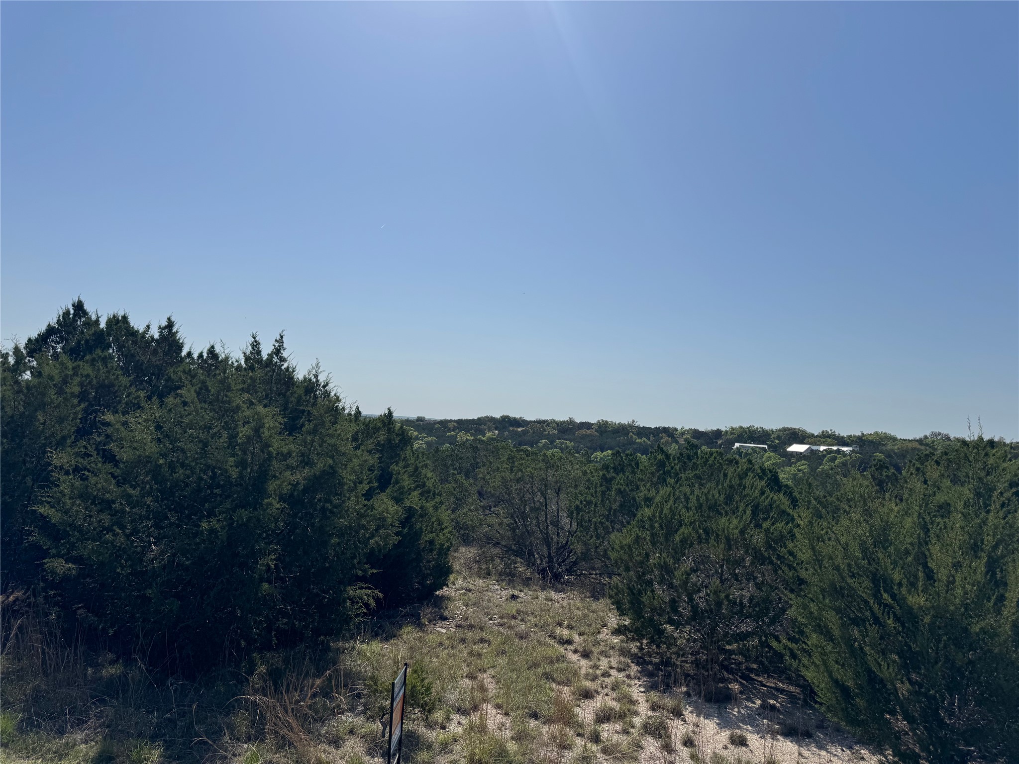 Lot 53 Balcones Ridge Way Bertram, TX 78605 - Photo 9 of 18 a view of a city with lush green forest