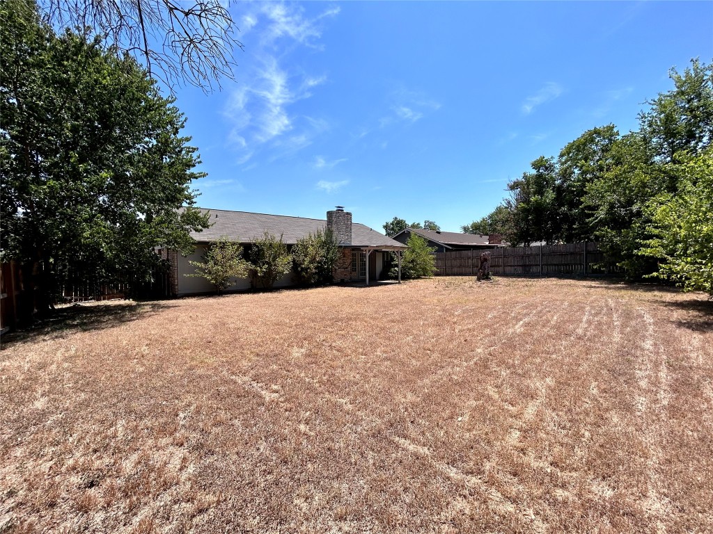 906 Spring Tree Street Round Rock, TX 78681 - Photo 18 of 18 a street view with large trees