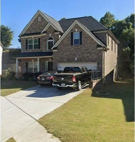 a view of a car parked in front of a house