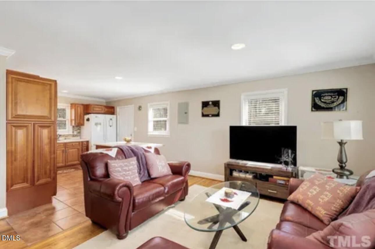 810 Milton Road Durham, NC 27712 - Photo 3 of 21 a living room with furniture and a flat screen tv