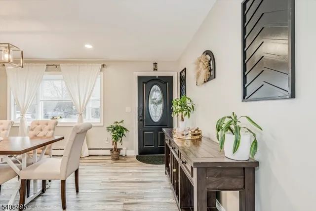 a kitchen with stainless steel appliances white cabinets and a stove top oven