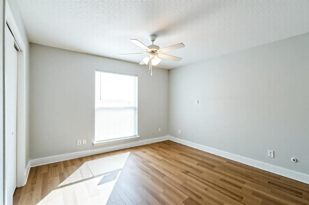 5522 Boca Raton Boulevard, Unit 404 Fort Worth, TX 76112 - Photo 9 of 13 Light an bright room with beautiful flooring