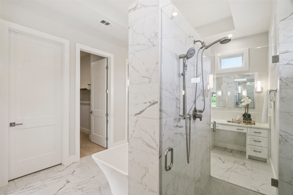 2404 Sailboat Pass Spicewood, TX 78669 - Photo 19 of 39 a bathroom with a shower and a sink