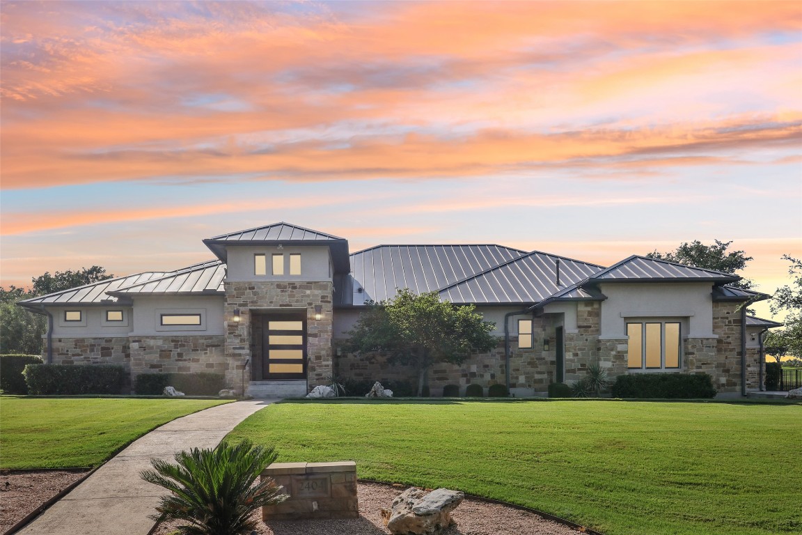 2404 Sailboat Pass Spicewood, TX 78669 - Photo 2 of 39 a view of a house with a yard
