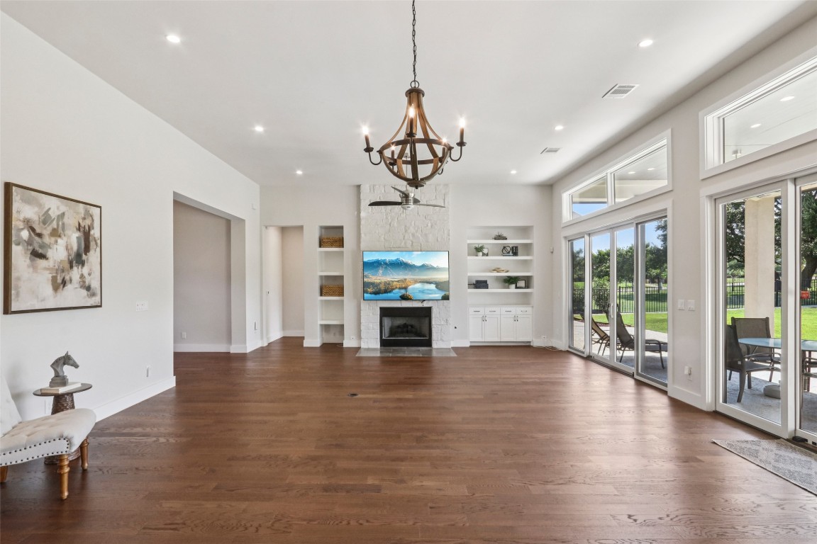 2404 Sailboat Pass Spicewood, TX 78669 - Photo 39 of 39 a view of a kitchen with furniture a floor to ceiling window and wooden floor