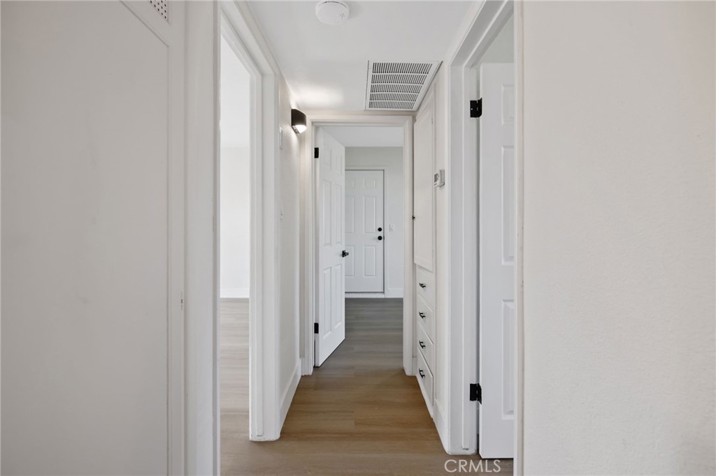 412 East Fairview Road Bakersfield, CA 93307 - Photo 17 of 28 a view of a hallway with white walls