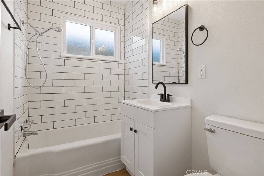 412 East Fairview Road Bakersfield, CA 93307 - Photo 19 of 28 a bathroom with a sink a toilet and shower