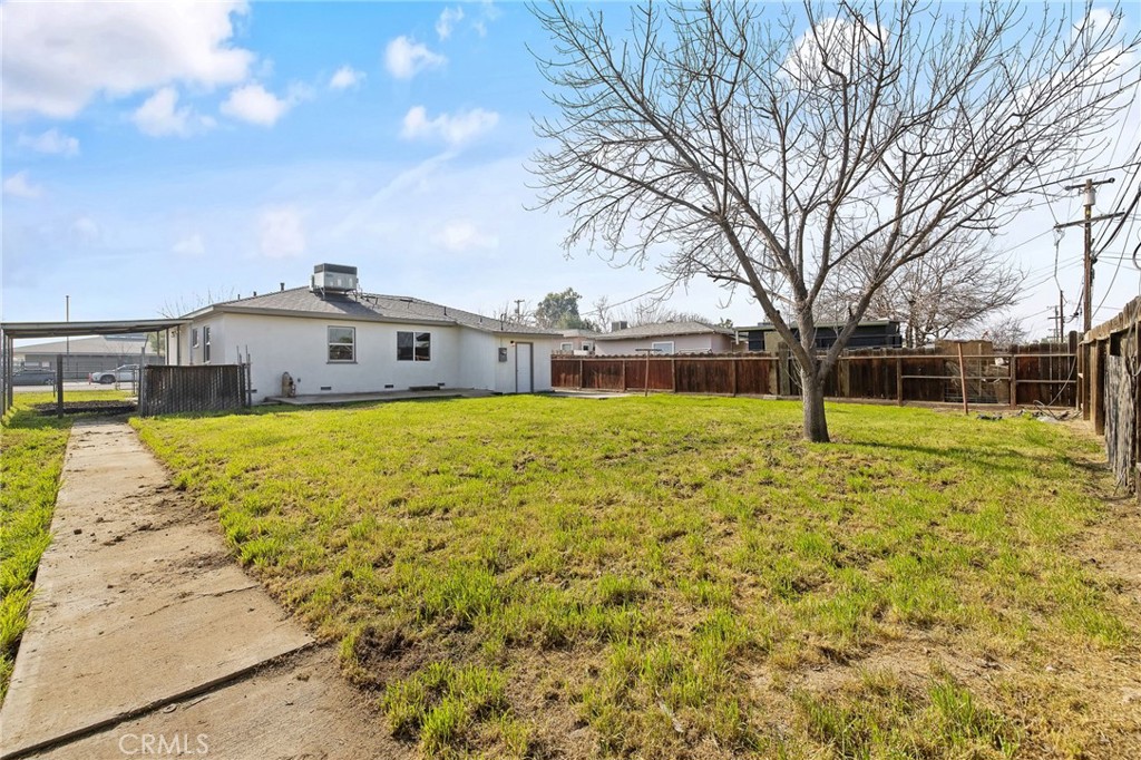 412 East Fairview Road Bakersfield, CA 93307 - Photo 25 of 28 a view of swimming pool with large trees and a big yard
