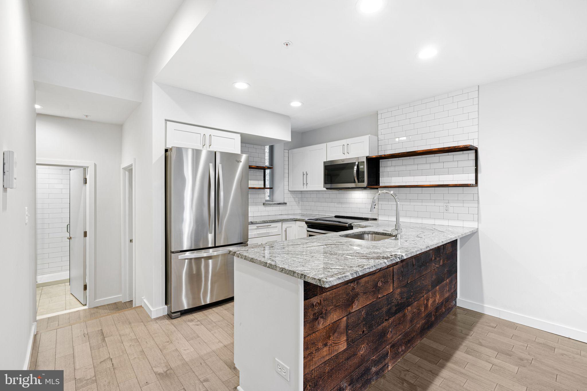 1734 Wylie Street, Unit B Philadelphia, PA 19130 - Photo 4 of 36 view from living room to kitchen