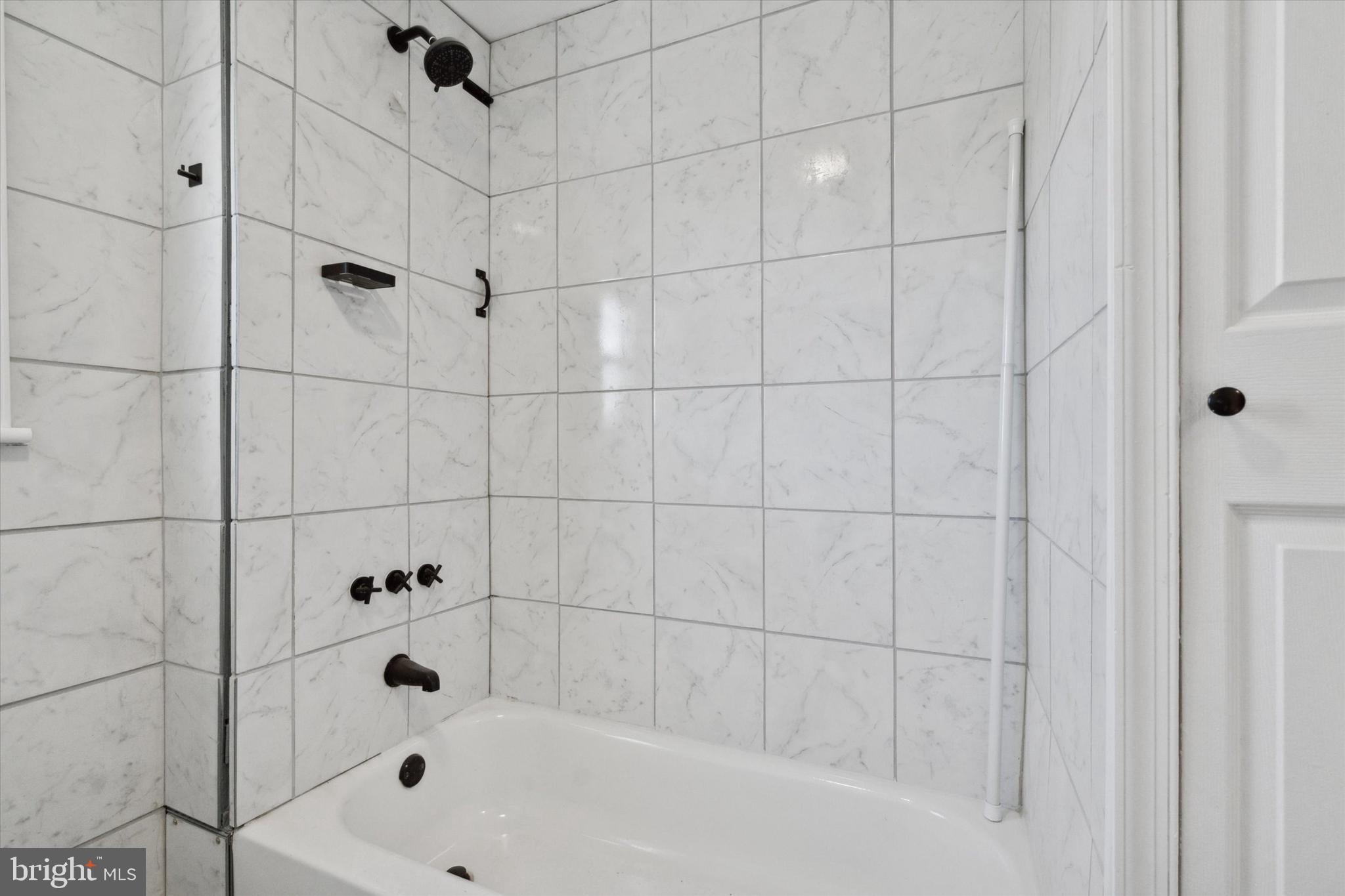 709 Chandler Street Philadelphia, PA 19111 - Photo 18 of 31 a bathroom with a bathtub