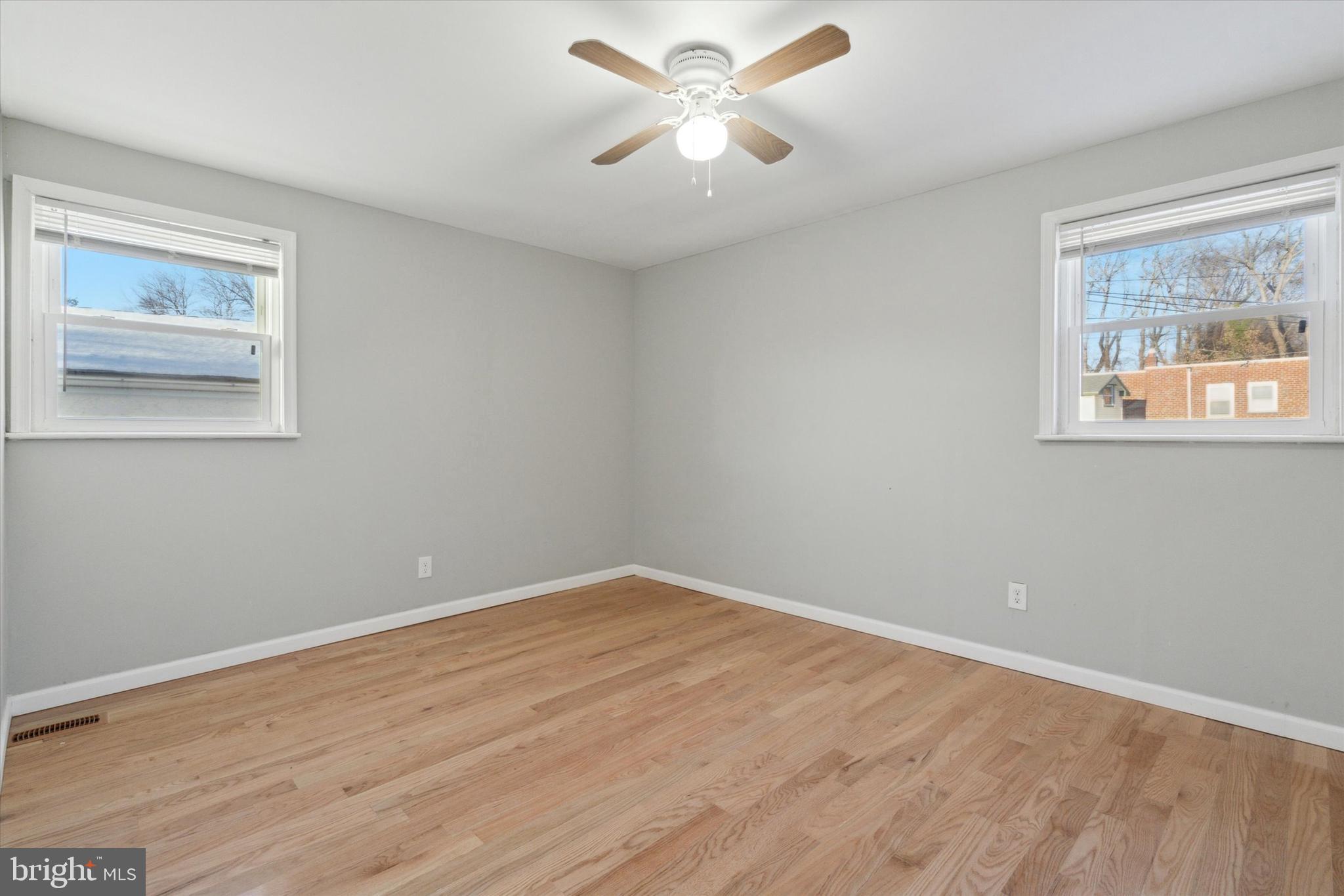 709 Chandler Street Philadelphia, PA 19111 - Photo 21 of 31 a view of an empty room with a window and a painting on the wall