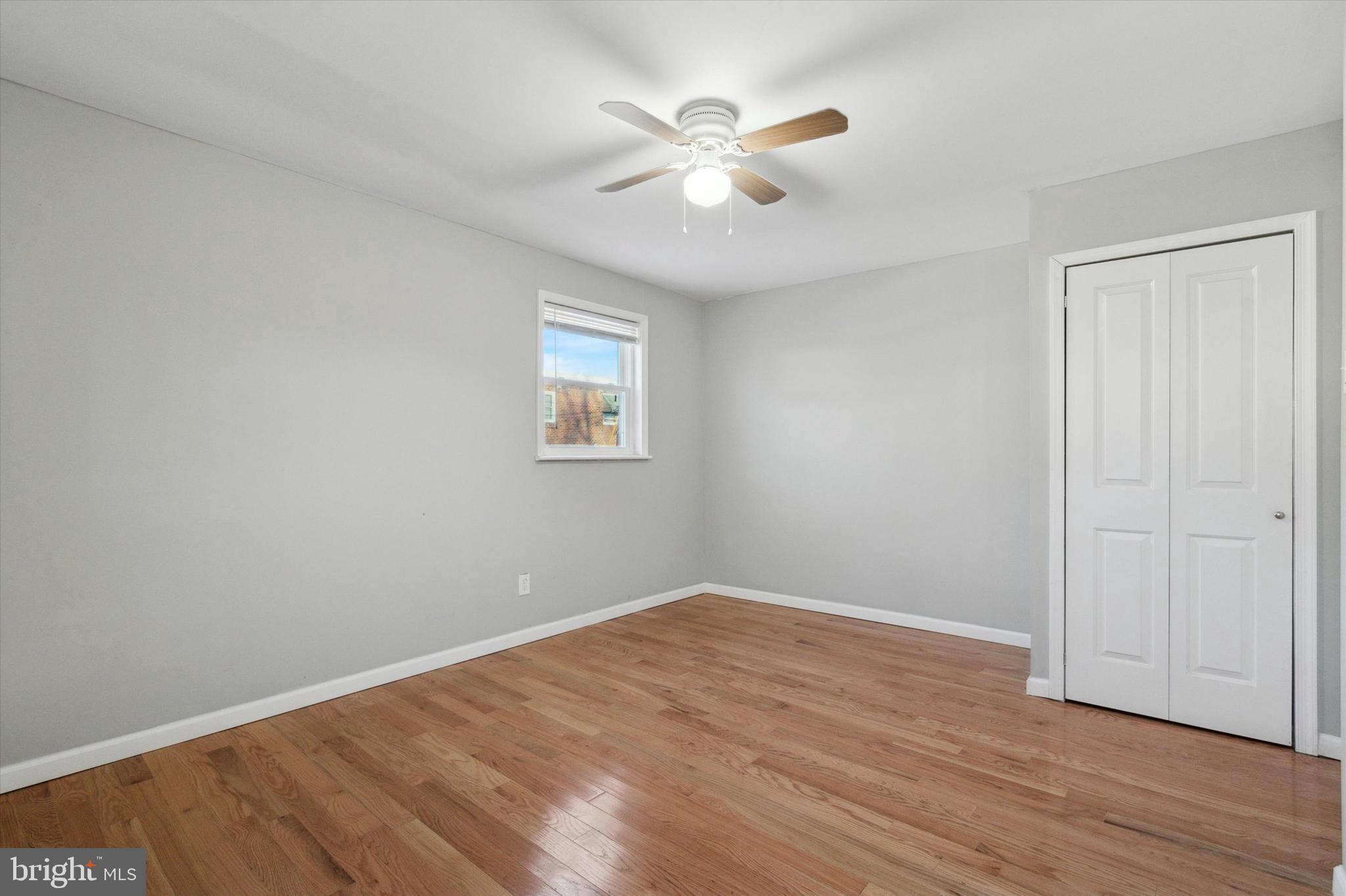 709 Chandler Street Philadelphia, PA 19111 - Photo 22 of 31 an empty room with wooden floor and ceiling fan
