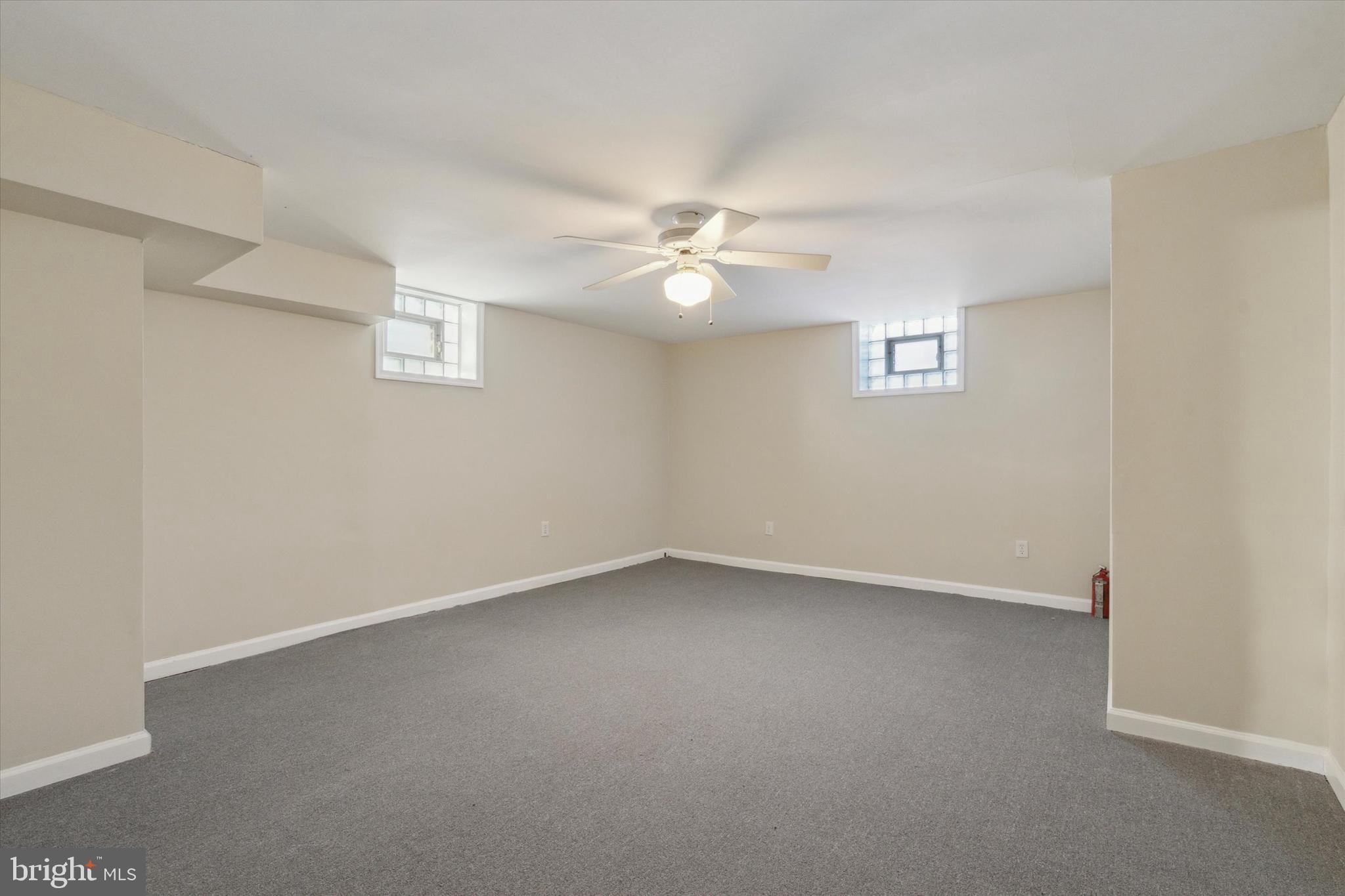 709 Chandler Street Philadelphia, PA 19111 - Photo 28 of 31 an empty room with a window and a ceiling fan