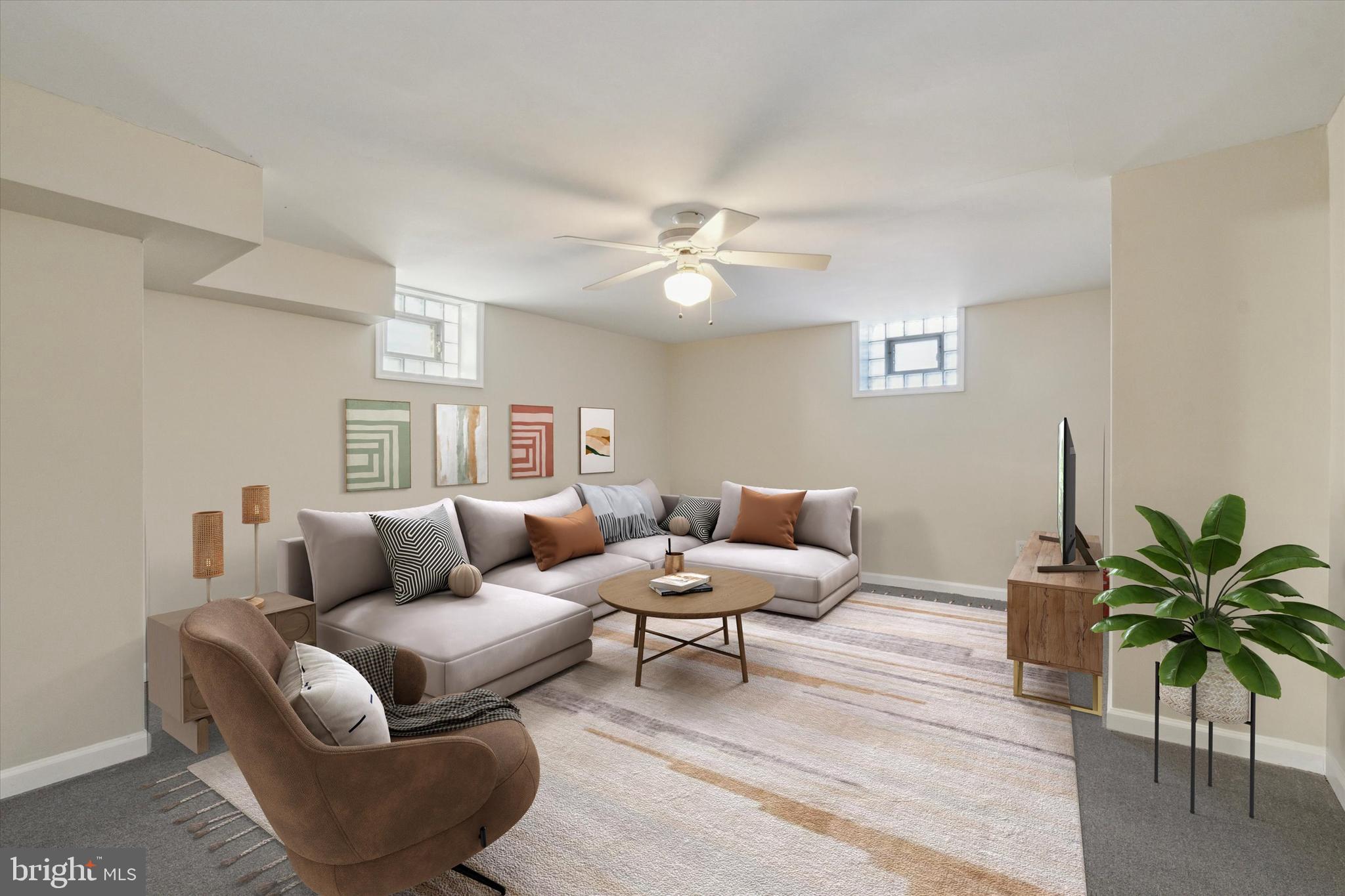 709 Chandler Street Philadelphia, PA 19111 - Photo 29 of 31 a living room with furniture and a potted plant