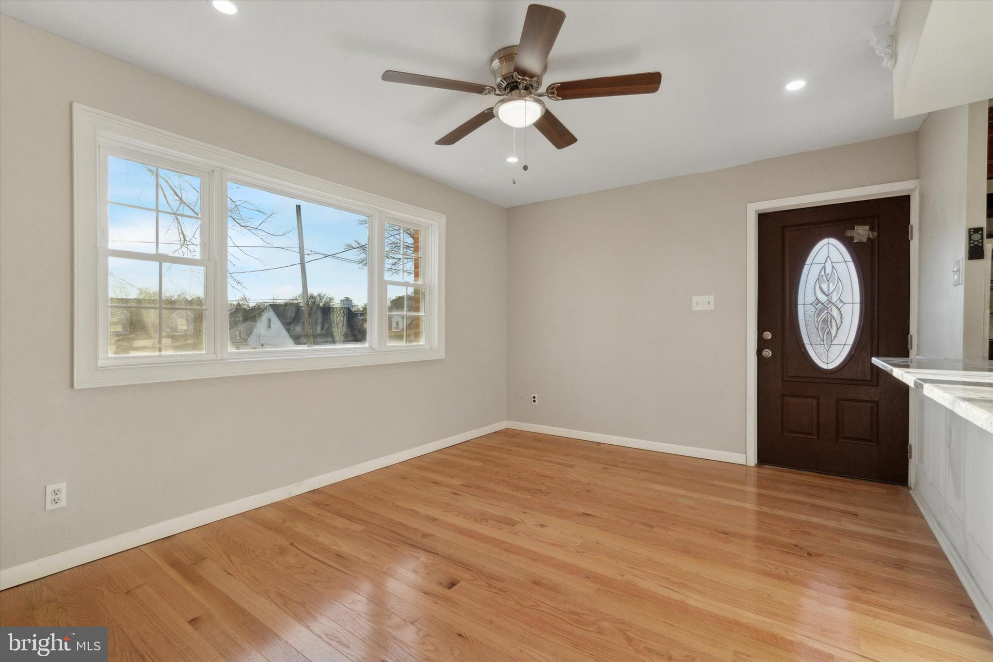 709 Chandler Street Philadelphia, PA 19111 - Photo 3 of 31 a view of a room with wooden floor and windows