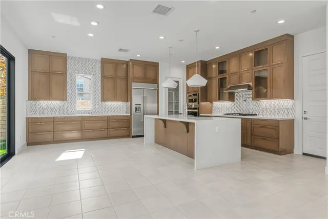 a bathroom with a double vanity sink a mirror and a