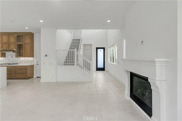 a view of an empty room with a fireplace