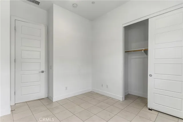 a bathroom with a granite countertop sink toilet a mirror and shower