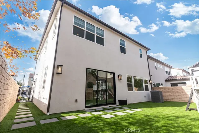 a view of house with yard