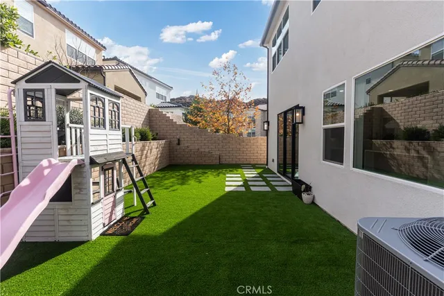 a bathroom with a granite countertop sink and a bathtub