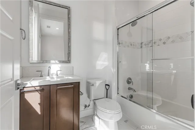 a bathroom with a sink a toilet and a bathtub