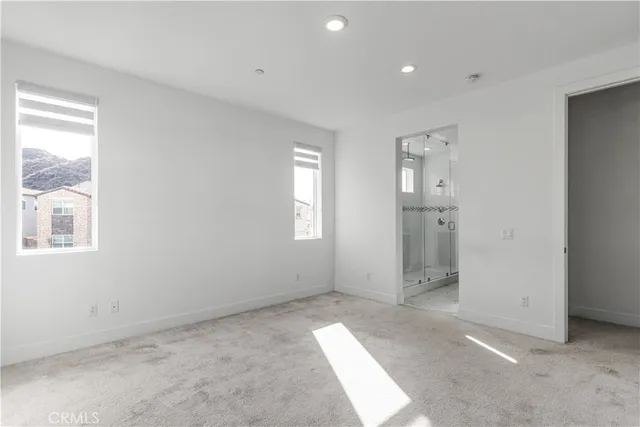 a view of hallway with windows