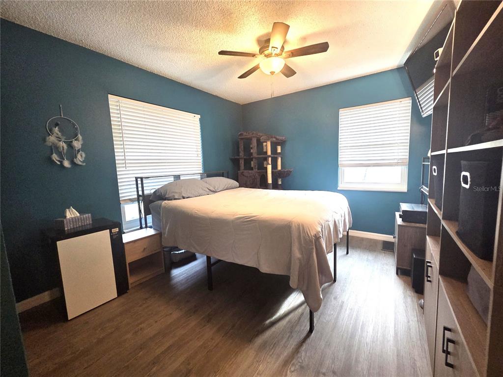 4059 Ligonier Road Spring Hill, FL 34608 - Photo 18 of 36 a bedroom with a bed and a desk