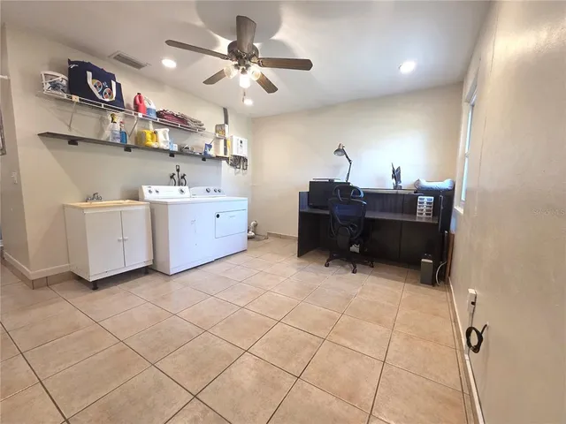a view of a workspace with furniture
