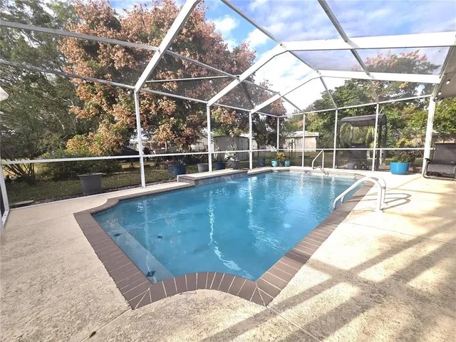 a view of outdoor space with swimming pool