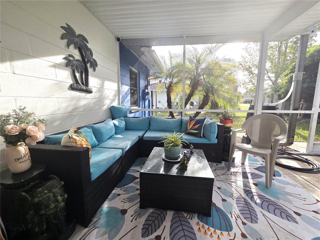 4059 Ligonier Road Spring Hill, FL 34608 - Photo 27 of 36 a living room with furniture and a large window