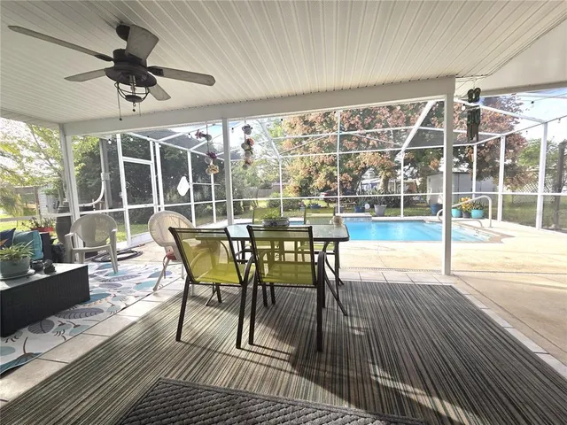 a view of a swimming pool with wooden floor