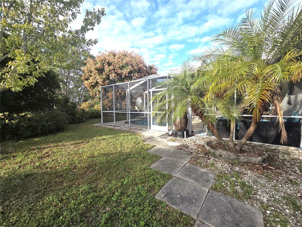 4059 Ligonier Road Spring Hill, FL 34608 - Photo 29 of 36 a view of a house with a yard