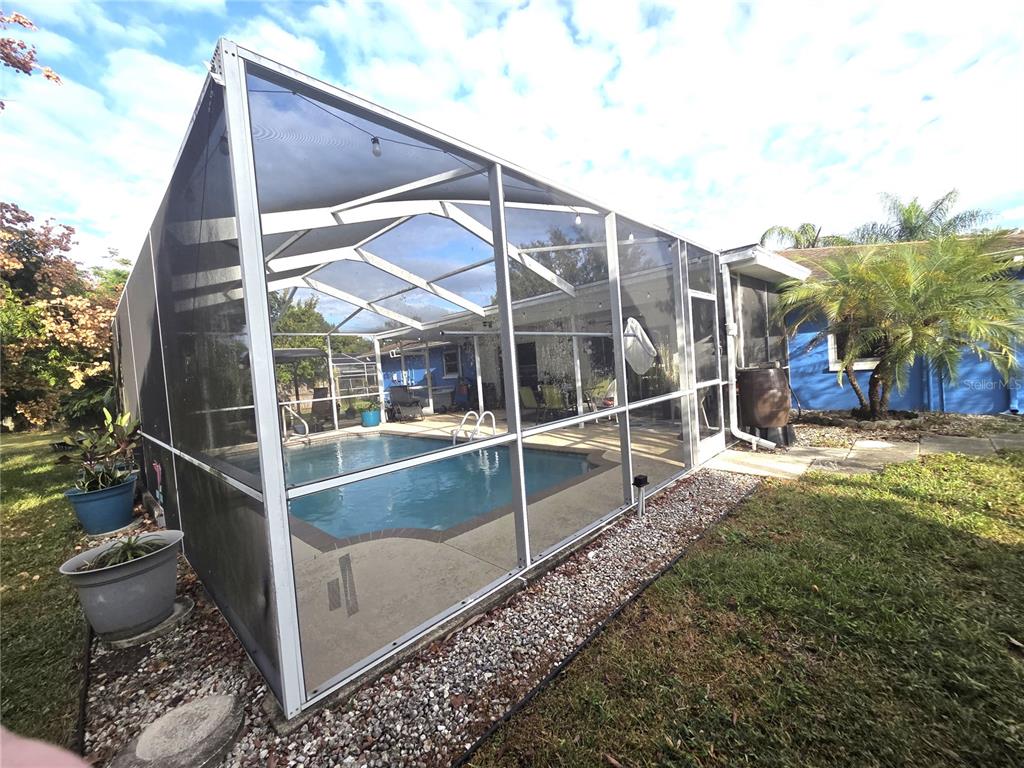 4059 Ligonier Road Spring Hill, FL 34608 - Photo 30 of 36 a view of a house with a backyard