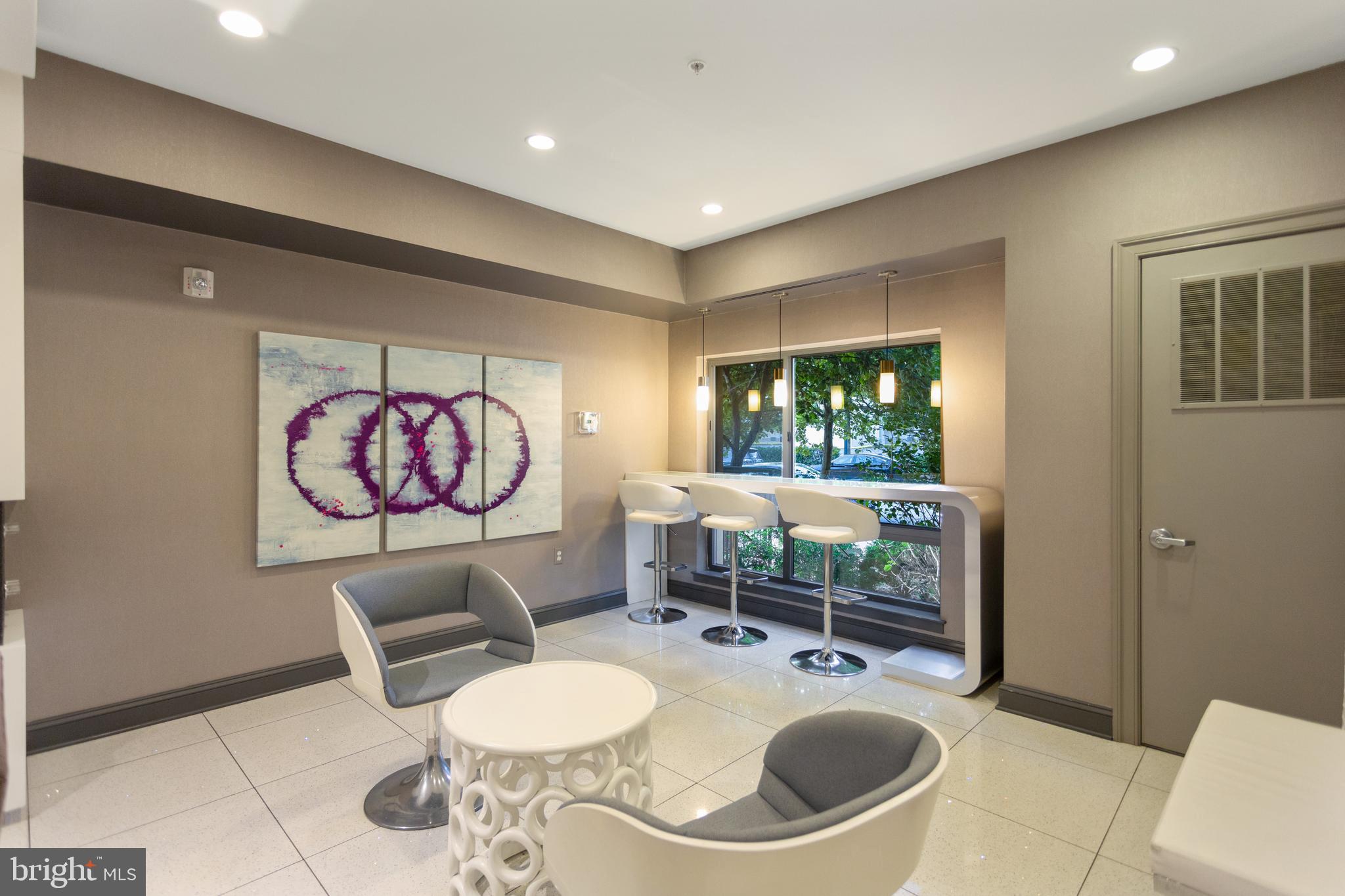 8005 13th Street, Unit 305 Silver Spring, MD 20910 - Photo 6 of 40 a lobby with furniture and window