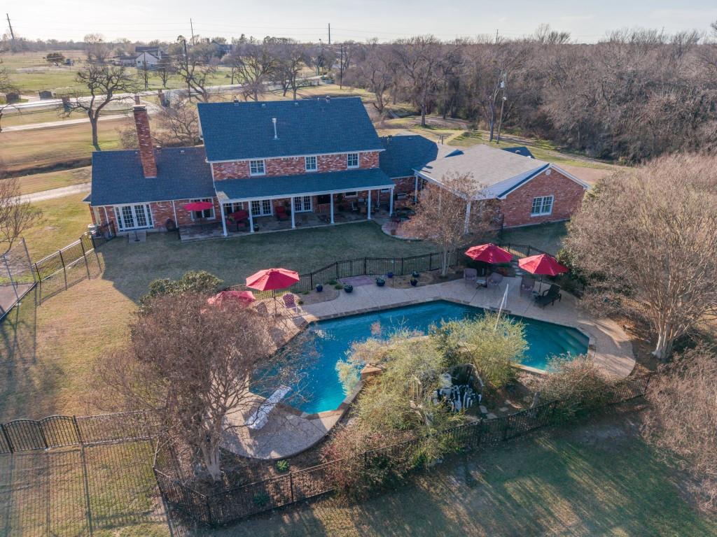 343 East Tripp Road Sunnyvale, TX 75182 - Photo 35 of 36 a view of houses with swimming pool