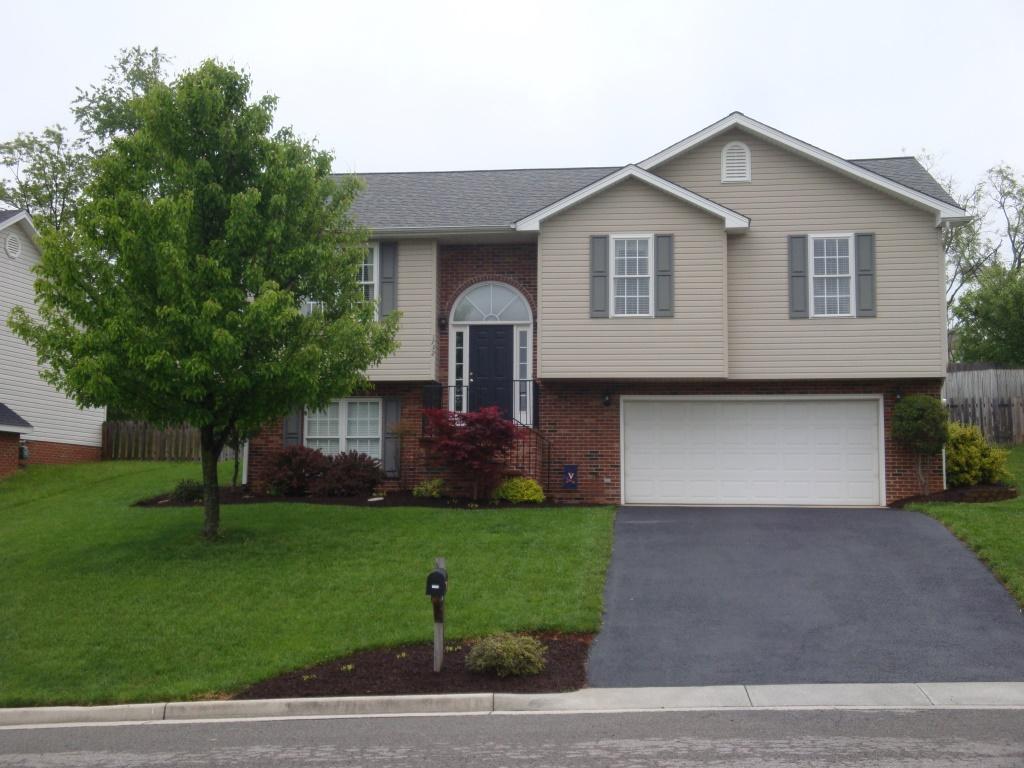 1732 Meadows Road Vinton, VA 24179 - Photo 1 of 32 a front view of a house with a yard and garage