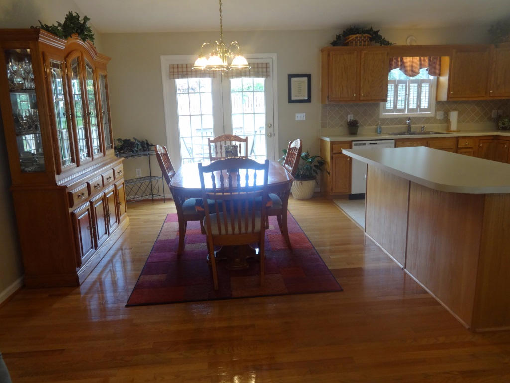 1732 Meadows Road Vinton, VA 24179 - Photo 15 of 32 a view of a dining room with furniture window and wooden floor