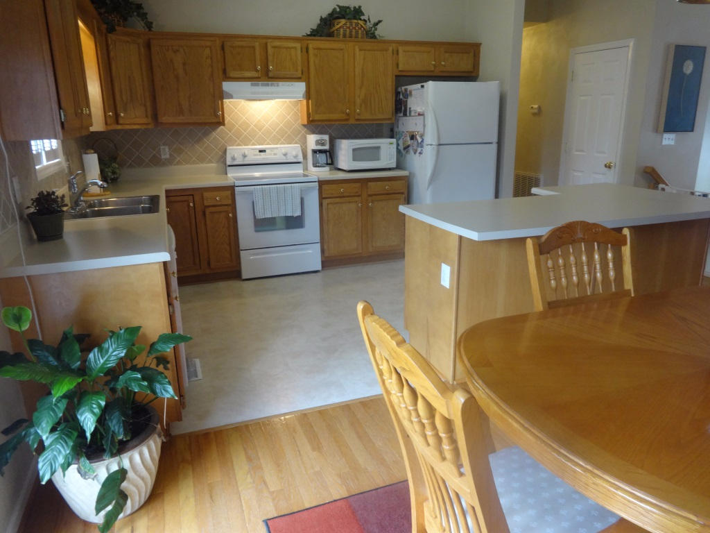 1732 Meadows Road Vinton, VA 24179 - Photo 20 of 32 a kitchen with cabinets a counter space and a stove