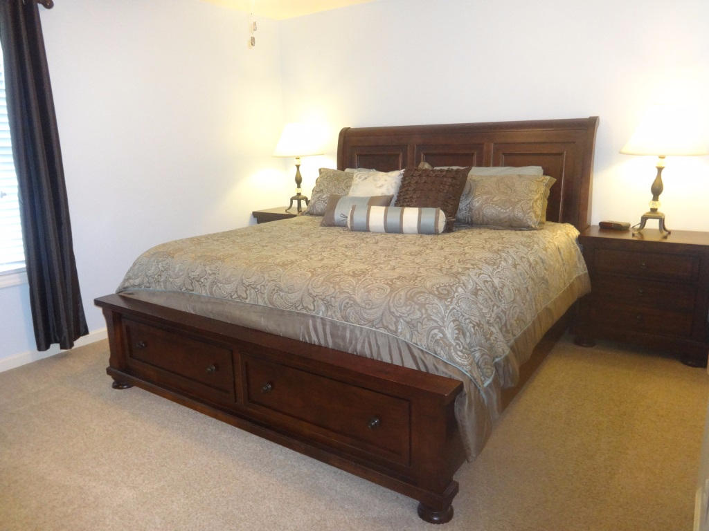 1732 Meadows Road Vinton, VA 24179 - Photo 24 of 32 a bedroom with a bed and lamp