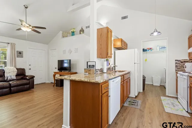a view of living room with furniture and flat screen tv