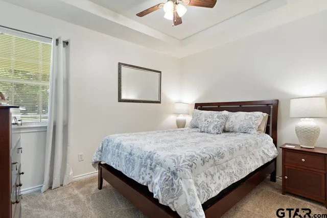 a bedroom with bed and window