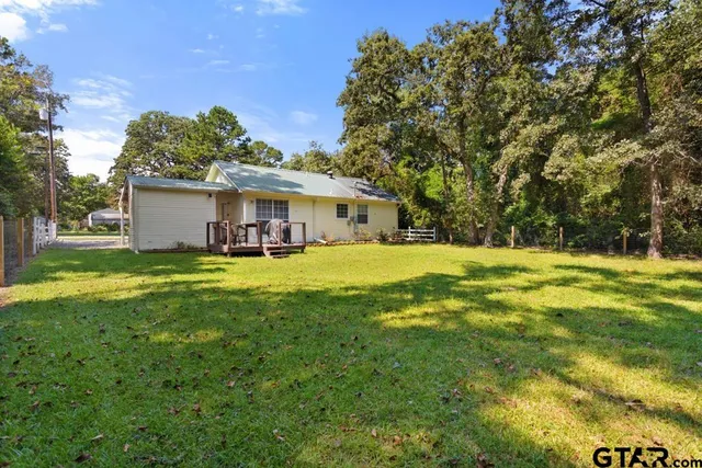 a view of a house with a big yard