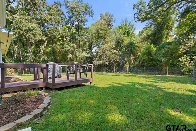 a view of a yard with a bench