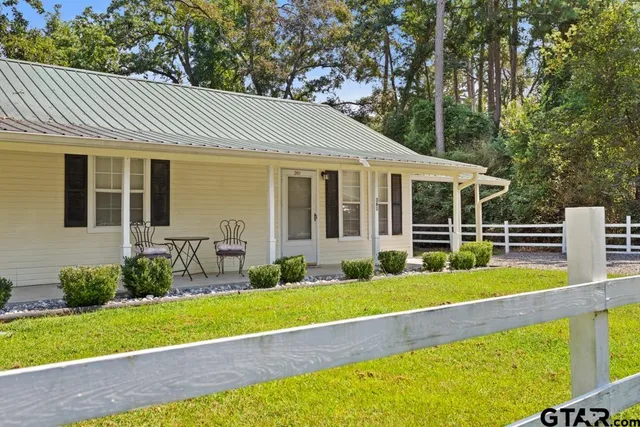 a view of house with a swimming pool